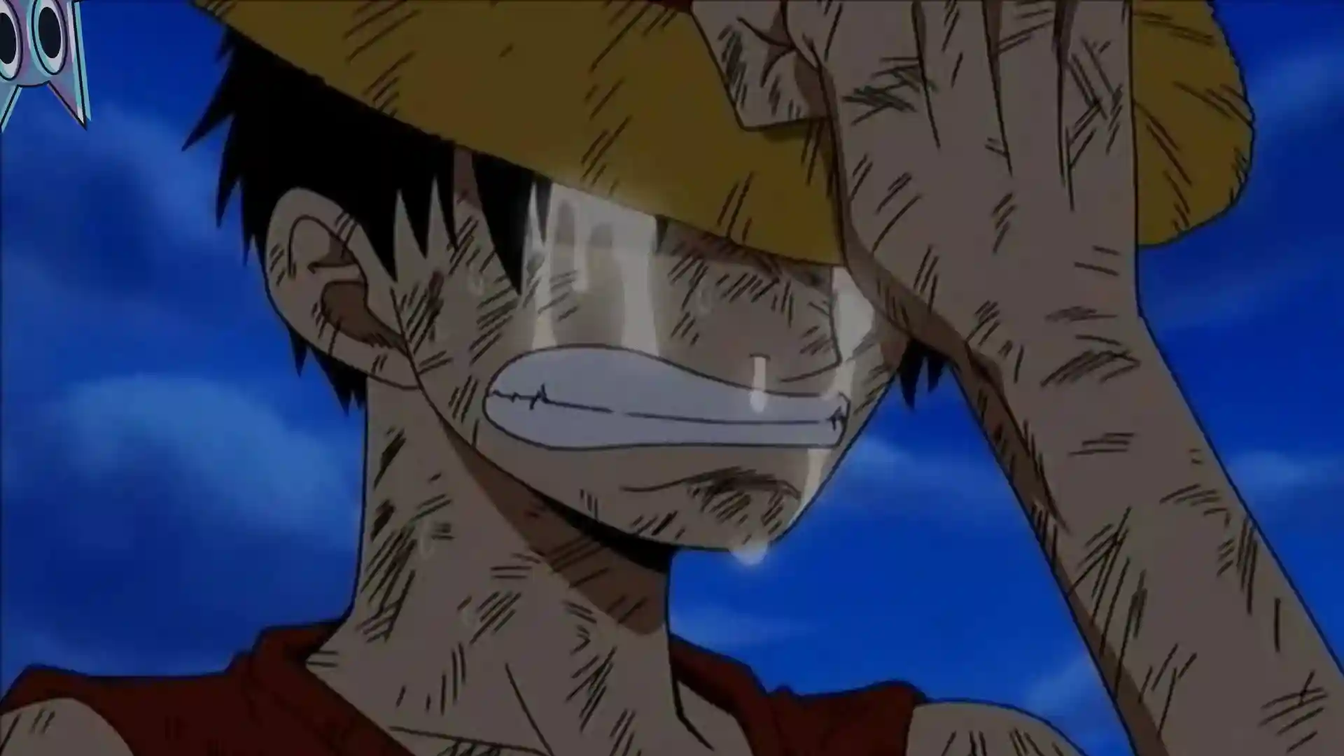 Luffy chorando com o seu chapéu de palha cobrindo o rosto, ilustrando a pausa do mangá de One Piece.